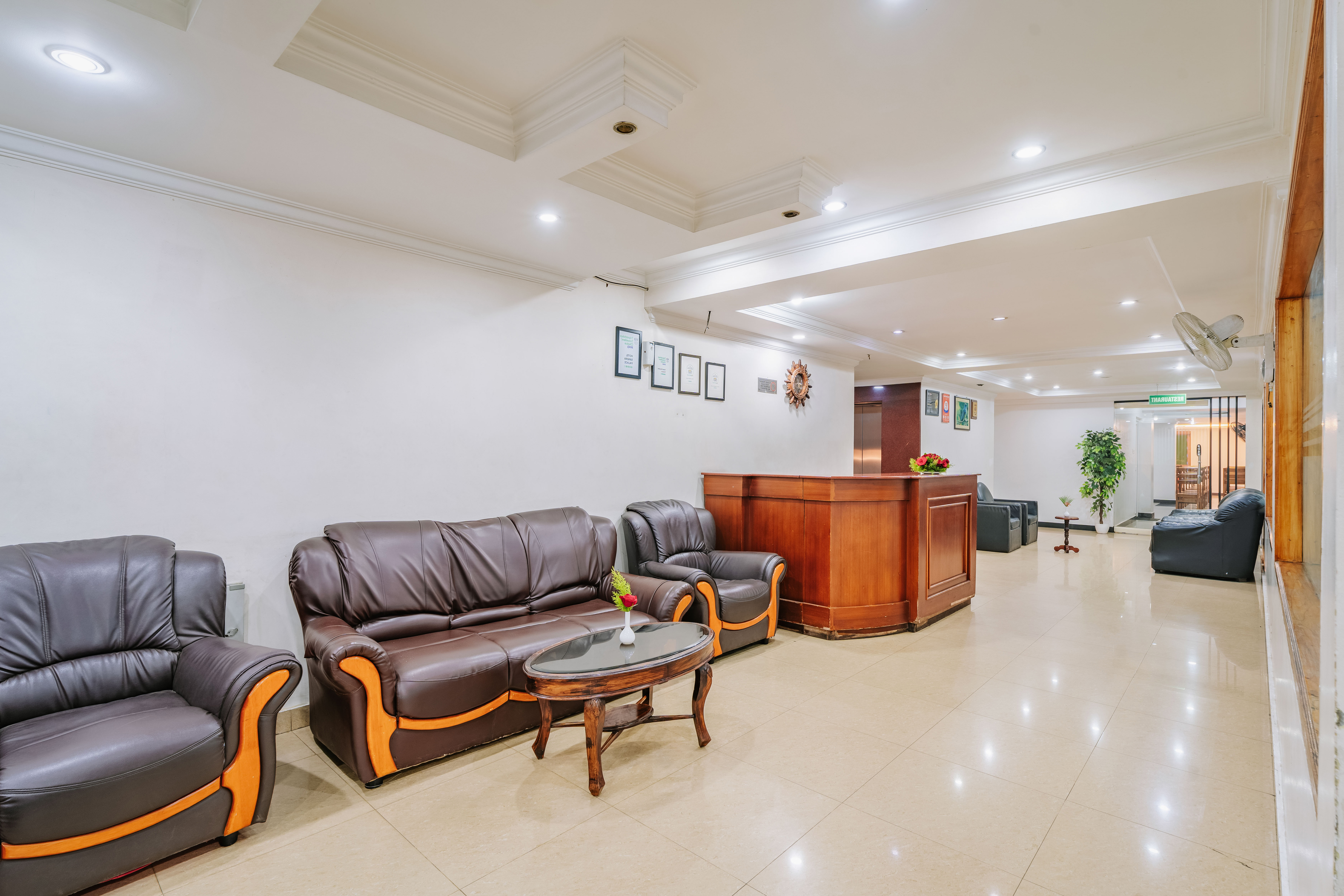 Reception desk and lobby seating at Hotel Sandra Palace, Thekkady